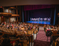 students enjoying a show